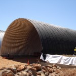 close-up - steel arch culverts waterproofed with cold spray-applied membrane at Pannawonica application to first rail culvert tunnel complete